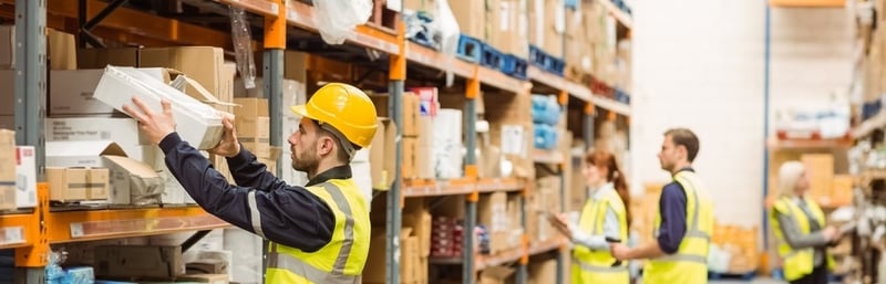 Warehouse worker taking package CROPPED 